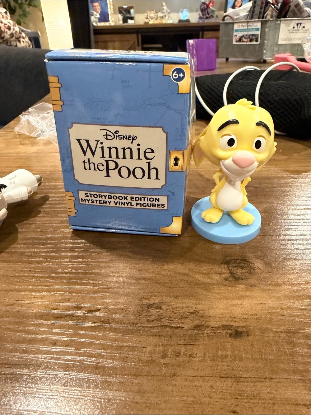 Winnie the Pooh vinyl figure on table
